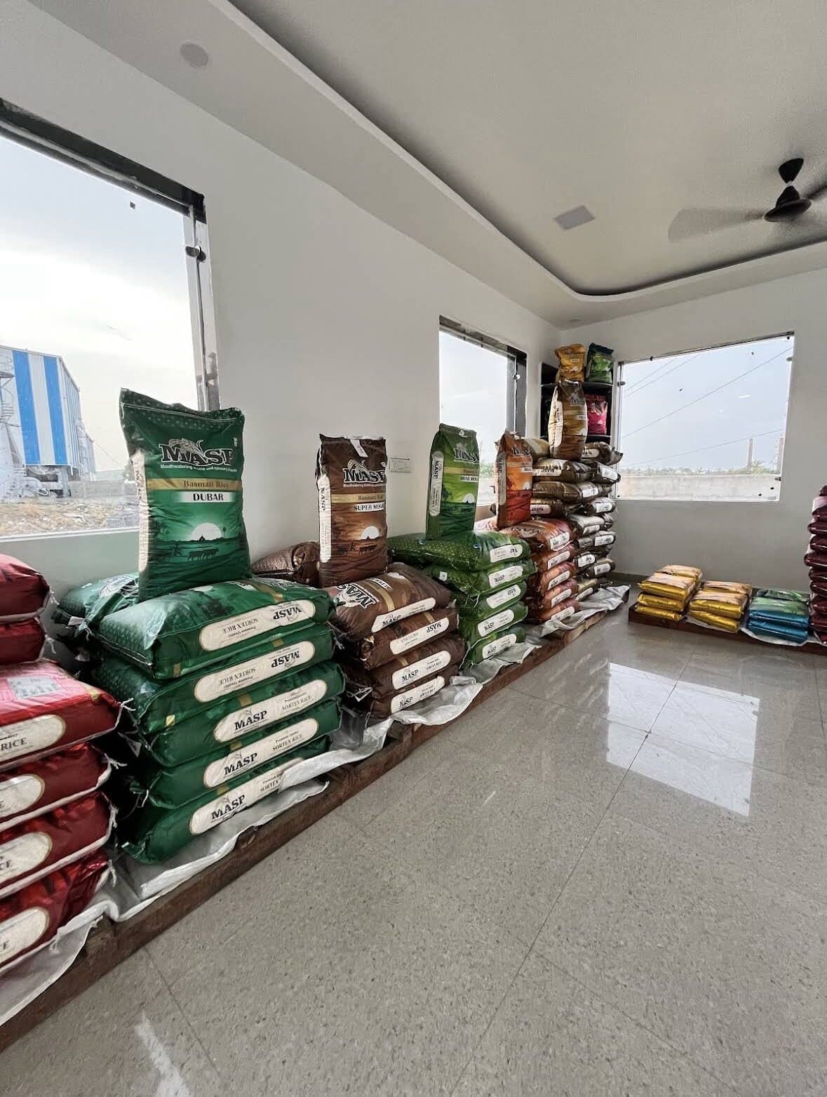 Stacked sacks of MASP Basmati rice in the finished-goods room